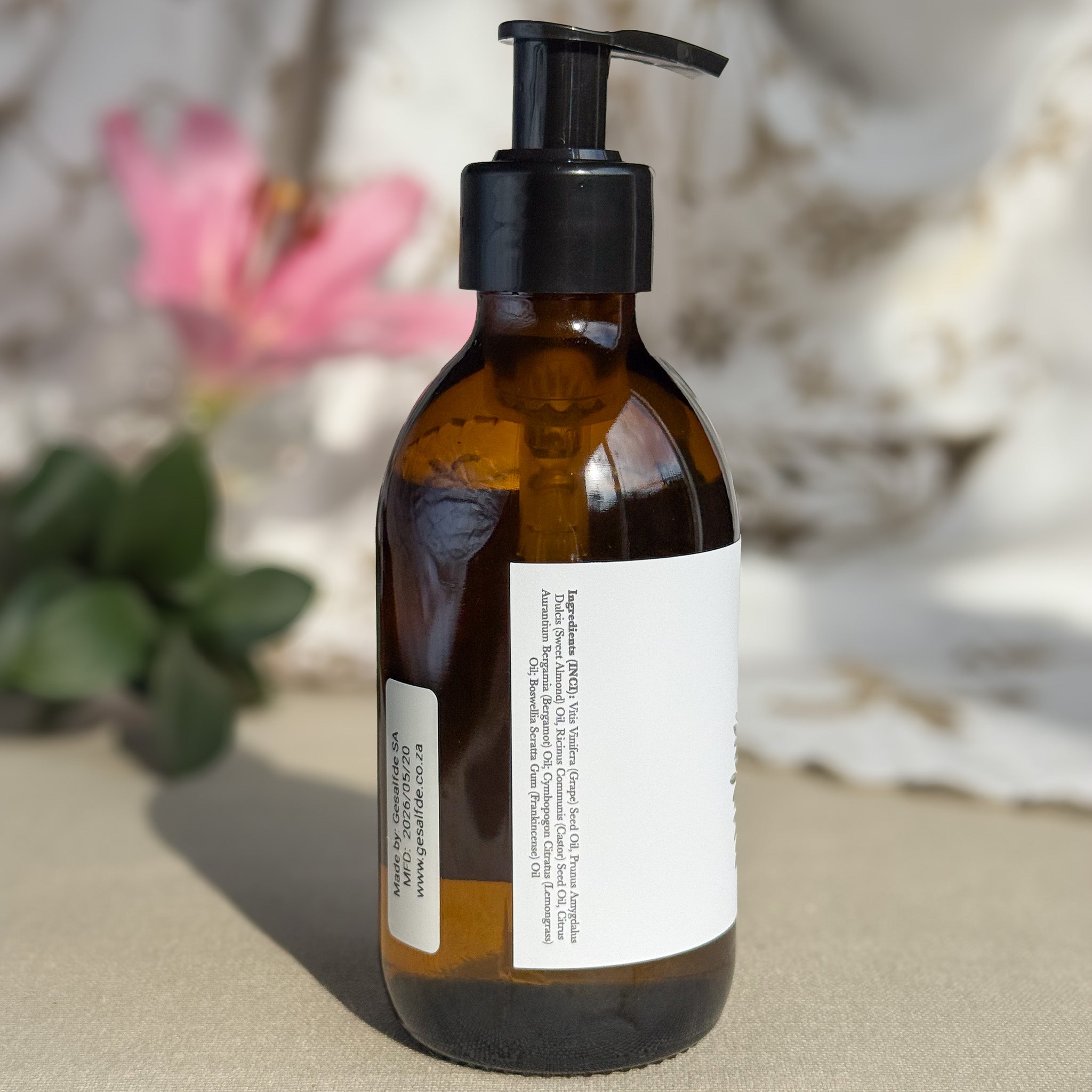 Body oil by Gesalfde in a glass pump bottle, promoting skin nourishment and self-care.