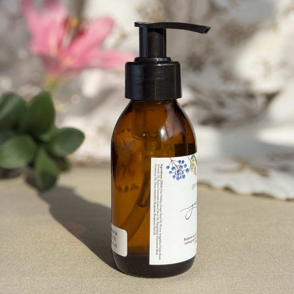 Body oil by Gesalfde in a glass pump bottle, promoting skin nourishment and self-care.