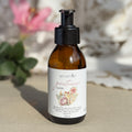 Body oil by Gesalfde in a glass pump bottle, promoting skin nourishment and self-care.