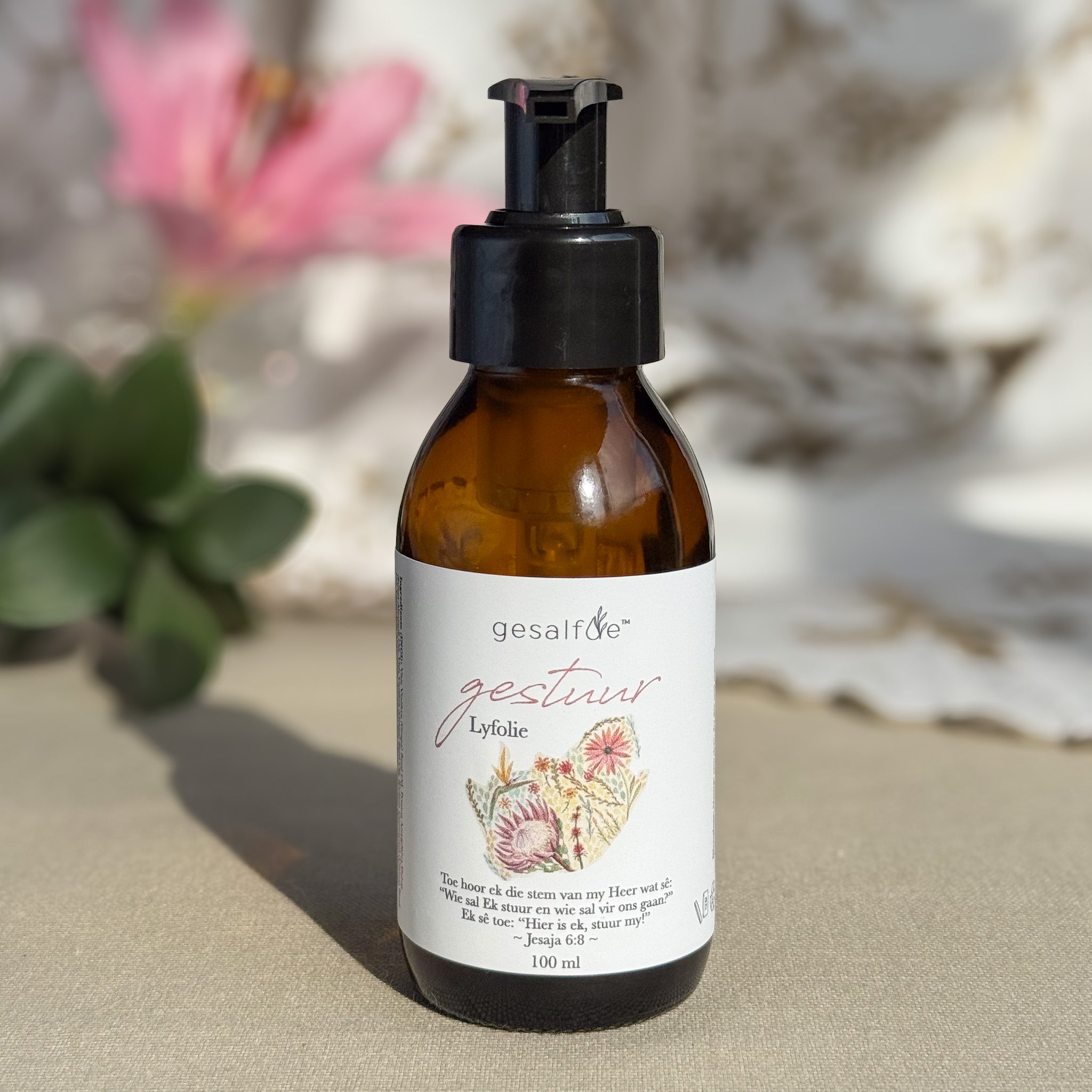Body oil by Gesalfde in a glass pump bottle, promoting skin nourishment and self-care.