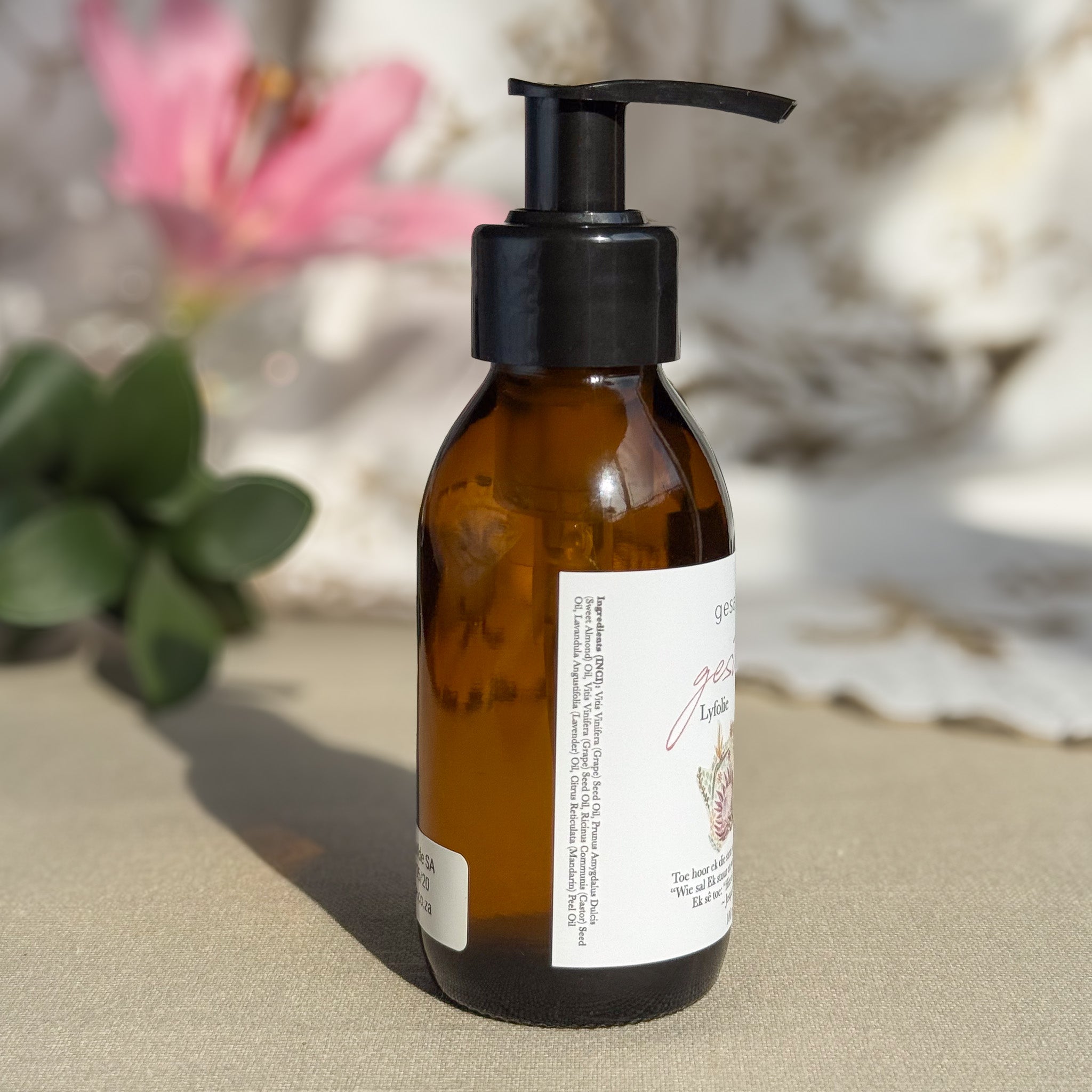 Body oil by Gesalfde in a glass pump bottle, promoting skin nourishment and self-care.