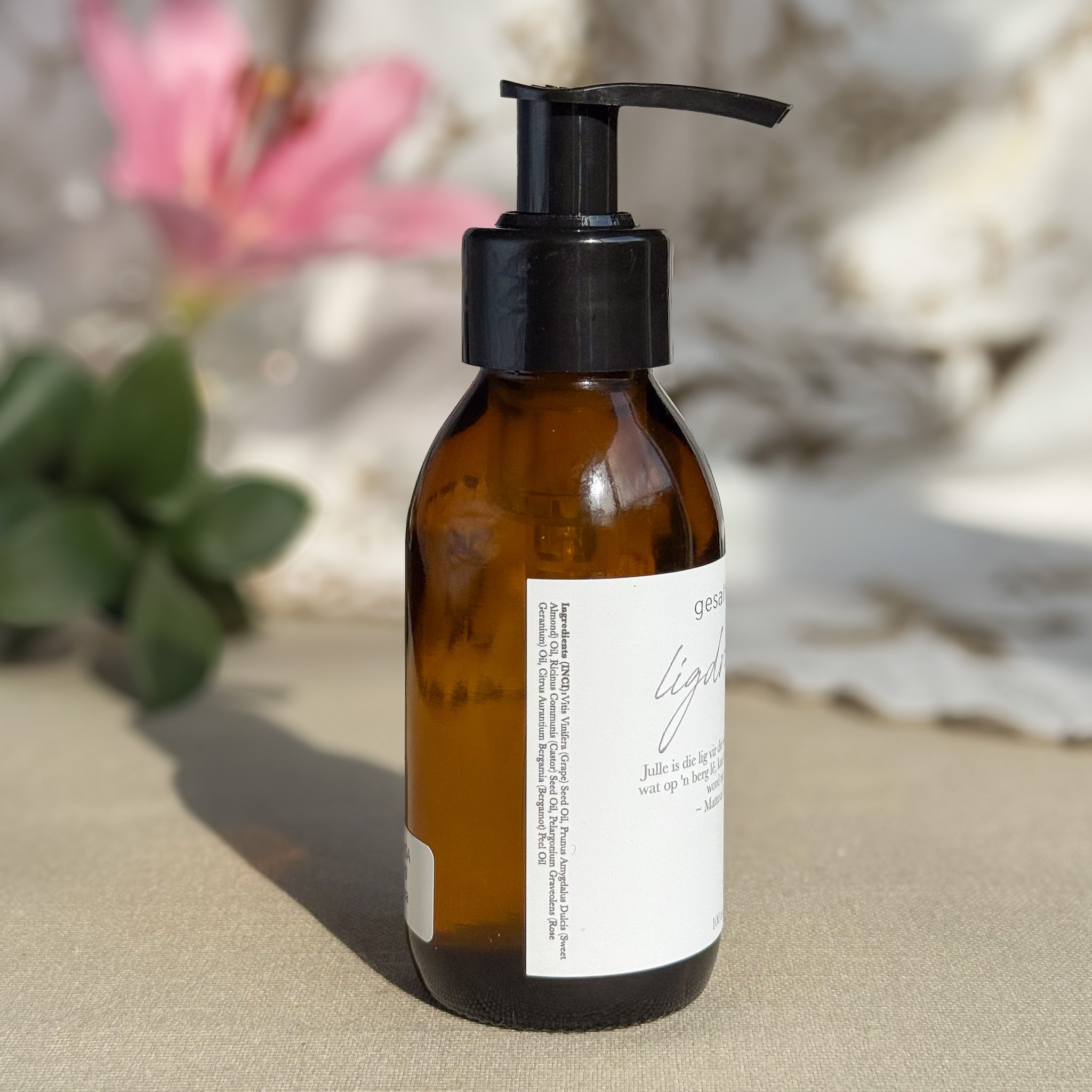 Body oil by Gesalfde in a glass pump bottle, promoting skin nourishment and self-care.