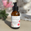 Body oil by Gesalfde in a glass pump bottle, promoting skin nourishment and self-care.