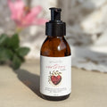 Body oil by Gesalfde in a glass pump bottle, promoting skin nourishment and self-care.