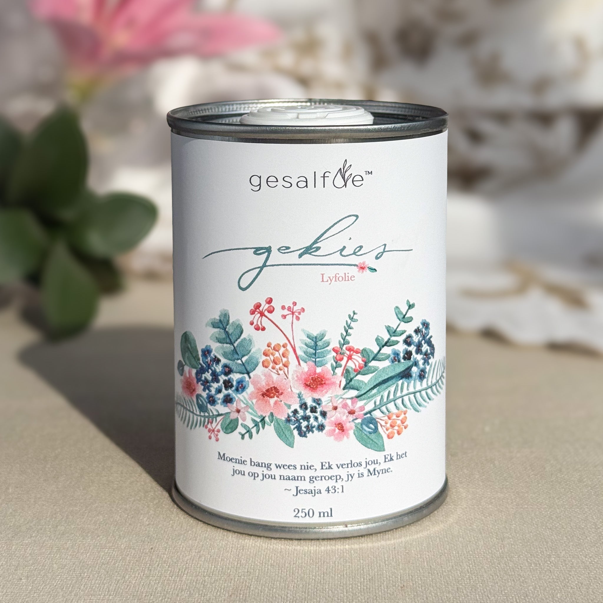Body oil by Gesalfde in a decorative can, promoting skin nourishment and self-care.