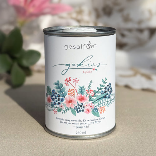 Body oil by Gesalfde in a decorative can, promoting skin nourishment and self-care.