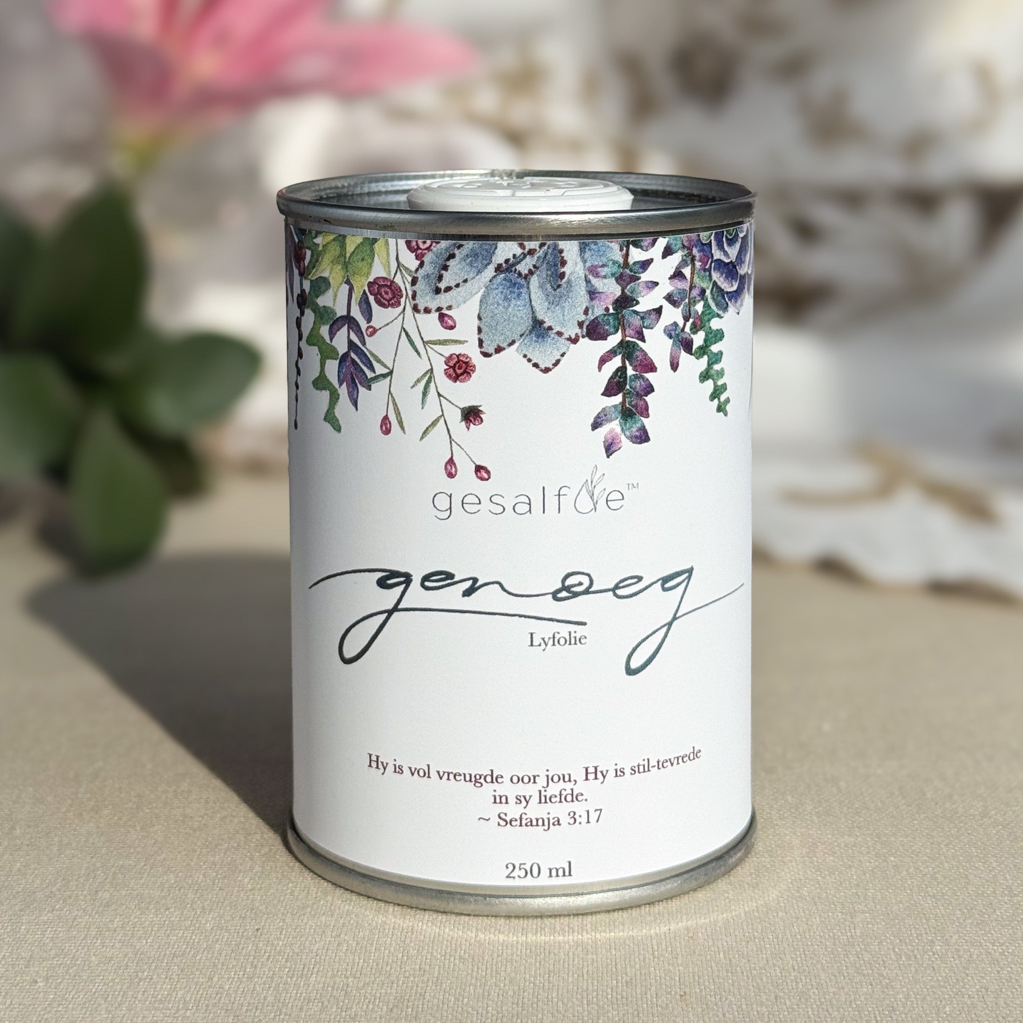 Body oil by Gesalfde in a decorative can, promoting skin nourishment and self-care.