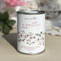 Body oil by Gesalfde in a decorative can, promoting skin nourishment and self-care.