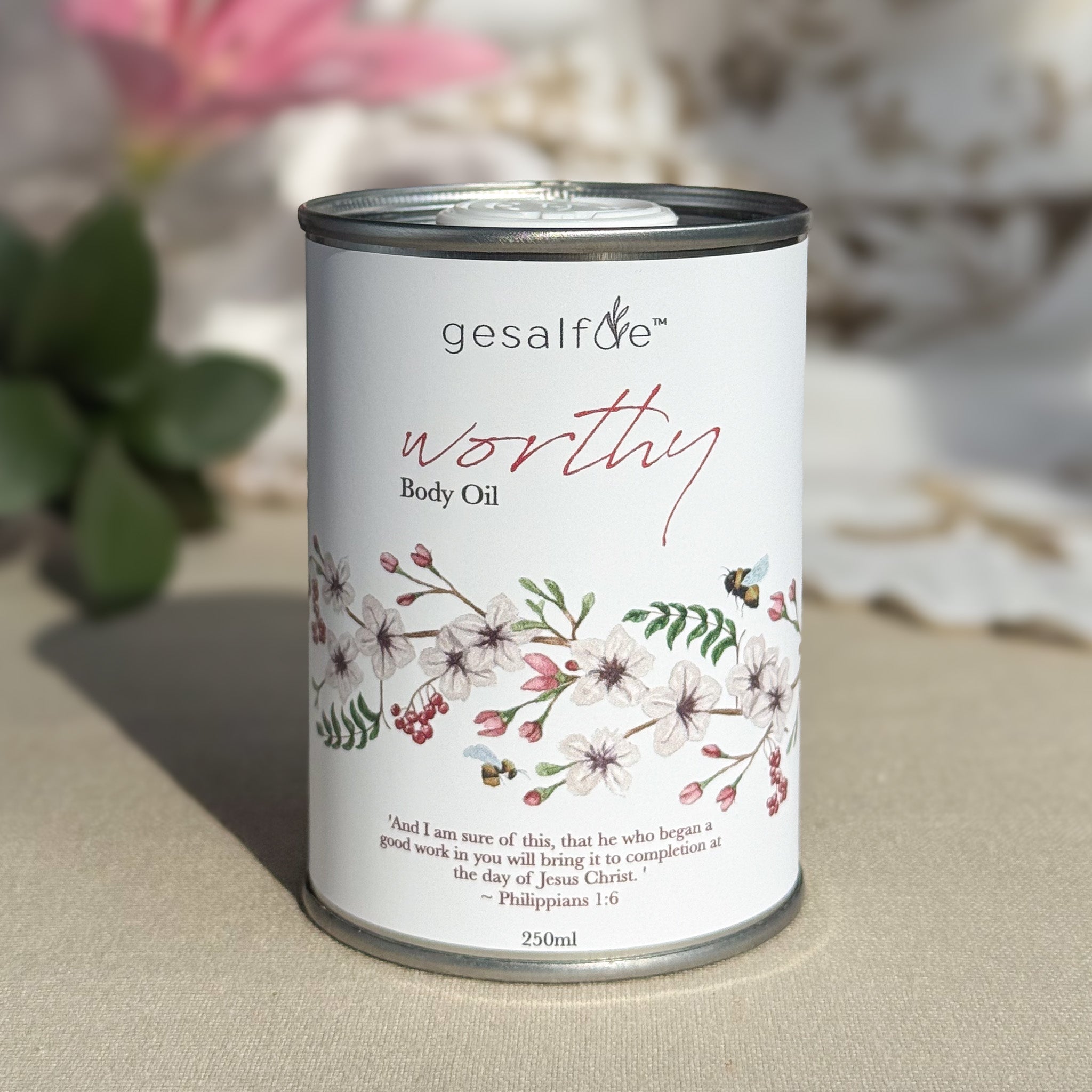 Body oil by Gesalfde in a decorative can, promoting skin nourishment and self-care.