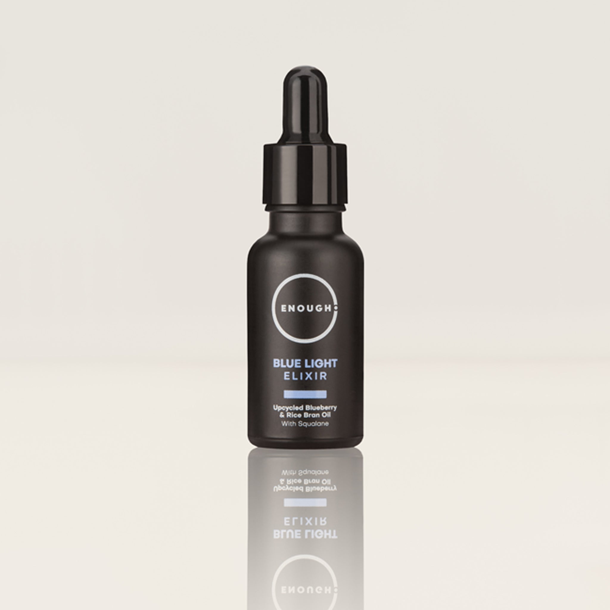 Black bottle of 'Enough' Blue Light Elixir on a light gray background