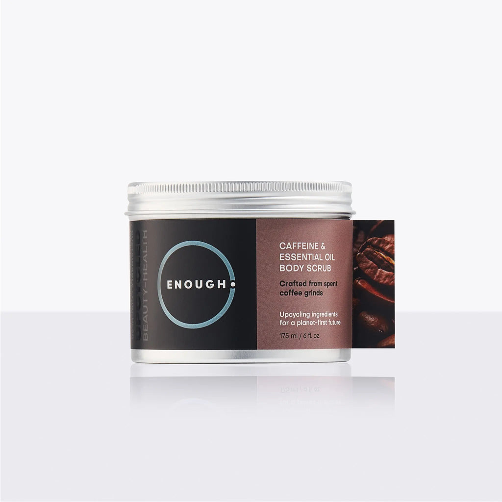 Container of ENOUGH caffeine and essential oil body scrub on a white background