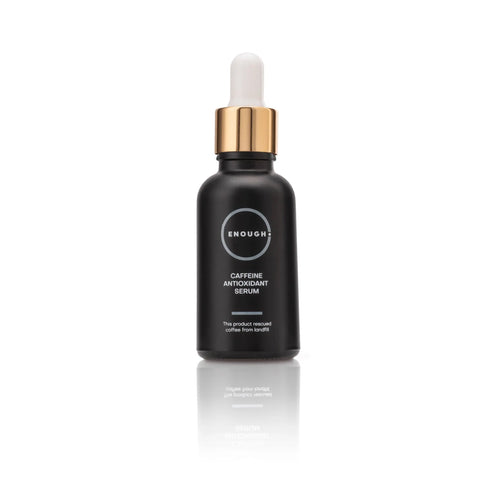 Black serum bottle with gold cap containing Caffeine Antioxidant serum on a white background
