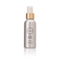 Silver bottle with gold cap containing Caffeine Enhanced Tissues Oil on a white background