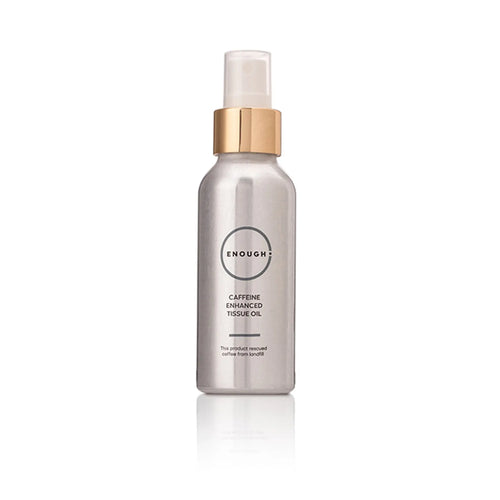Silver bottle with gold cap containing Caffeine Enhanced Tissues Oil on a white background