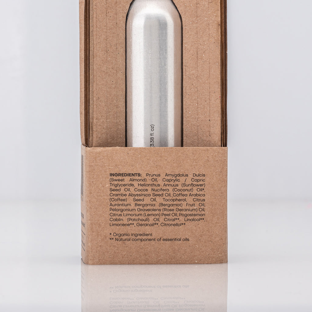 Silver bottle in a cardboard packaging with ingredient list of Caffeine Enhanced Tissues Oil 