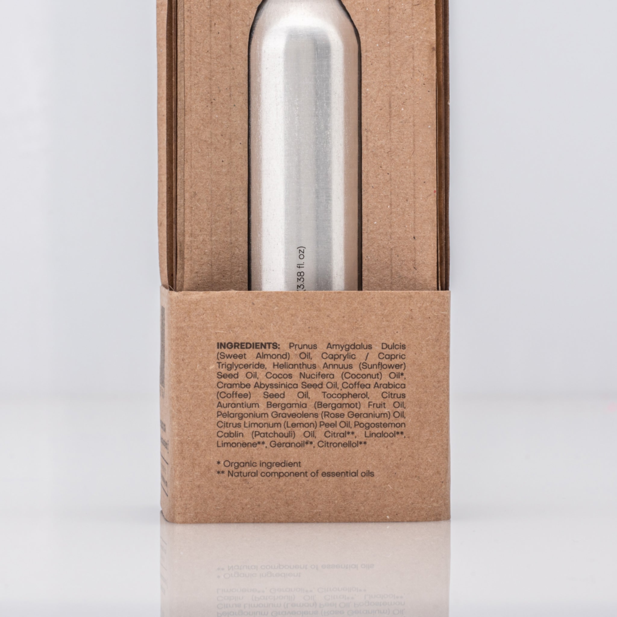 Silver bottle in a cardboard packaging with ingredient list of Caffeine Enhanced Tissues Oil 
