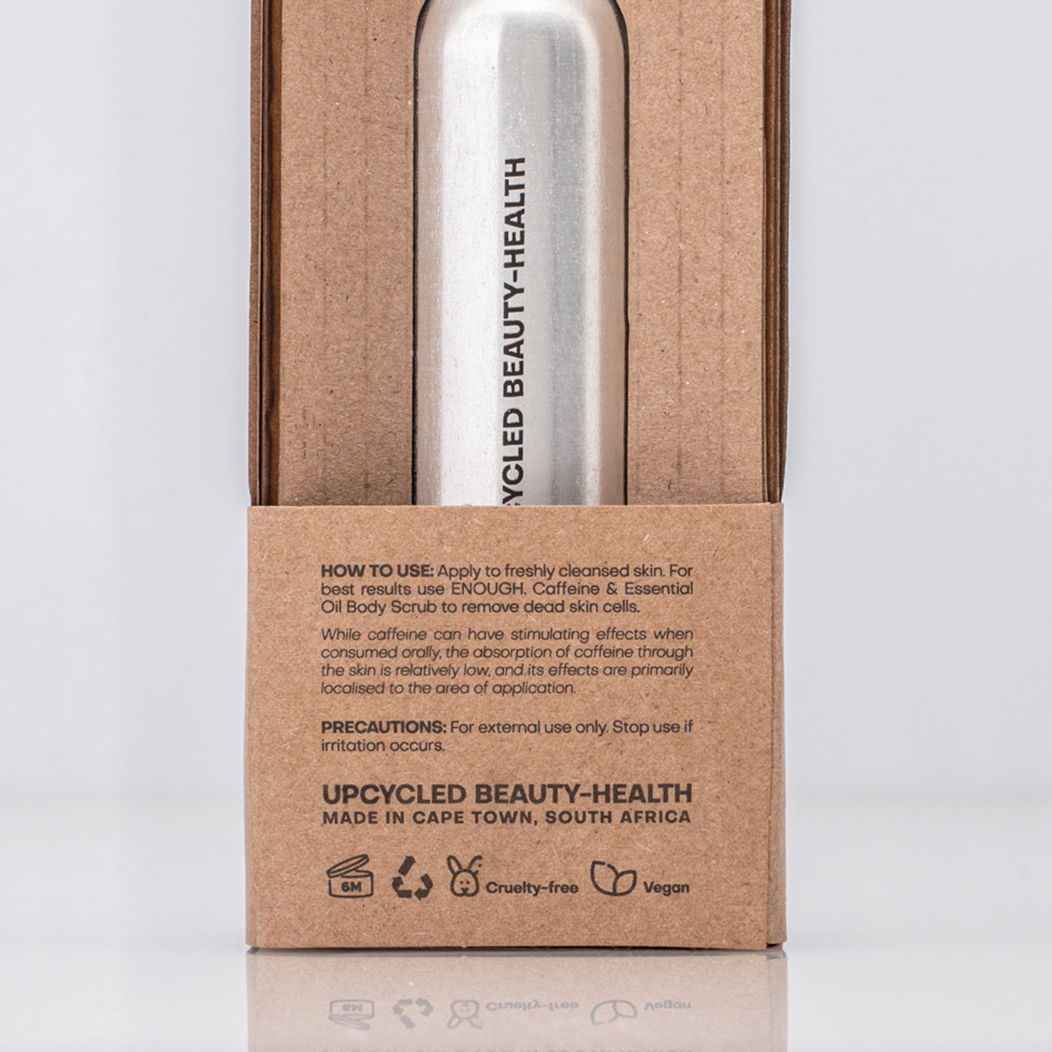 Silver bottle in a cardboard box with usage instructions for Caffeine Enhanced Tissues Oil 