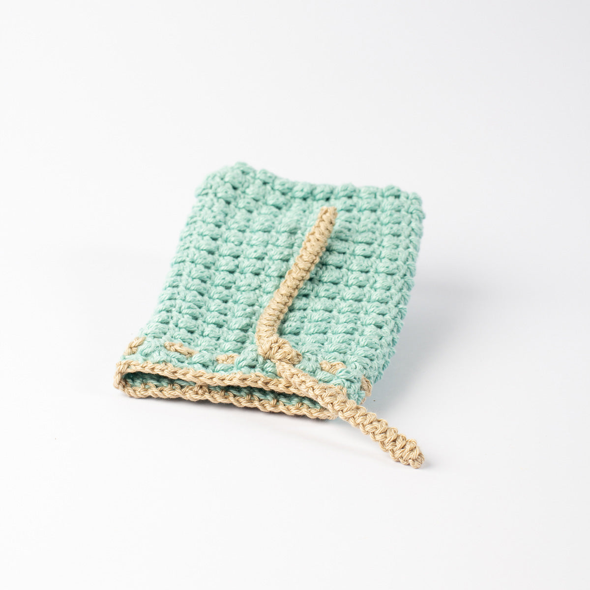 ECONIQUE cotton bar soap saver bag laid fully open showing hand-crocheted weave and dual-tone construction