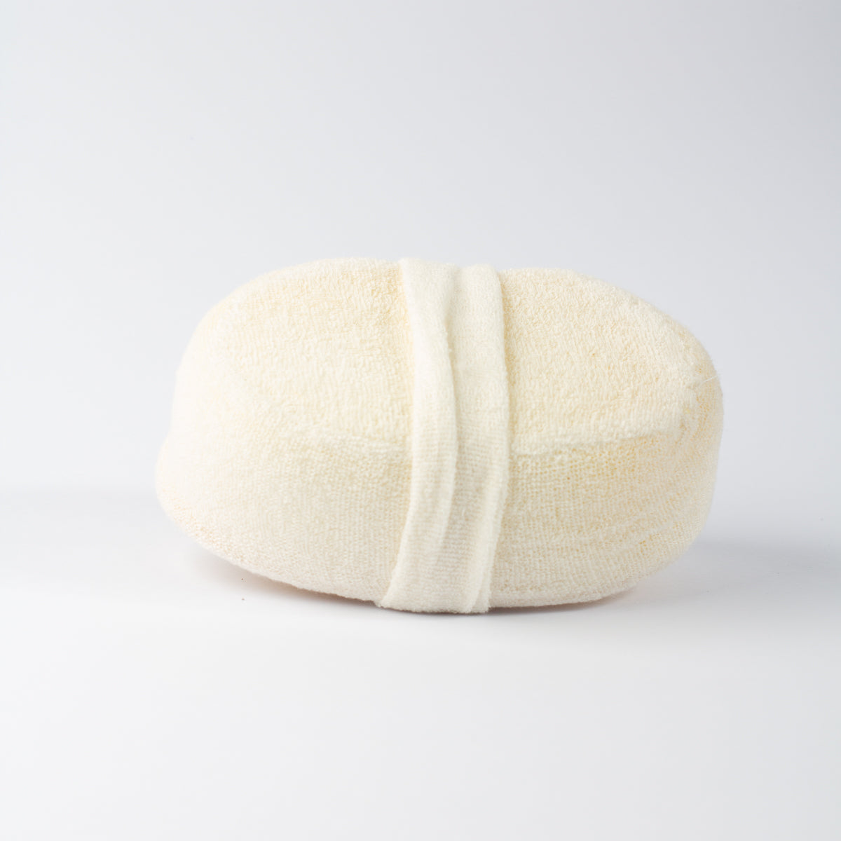 ECONIQUE Natural Loofah Body Sponge showing soft terry fabric reverse and hand strap detail, side-angle view on white background